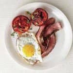 Steak and eggs with seared tomatoes