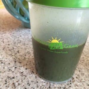 green superfood drink with warm water and honey